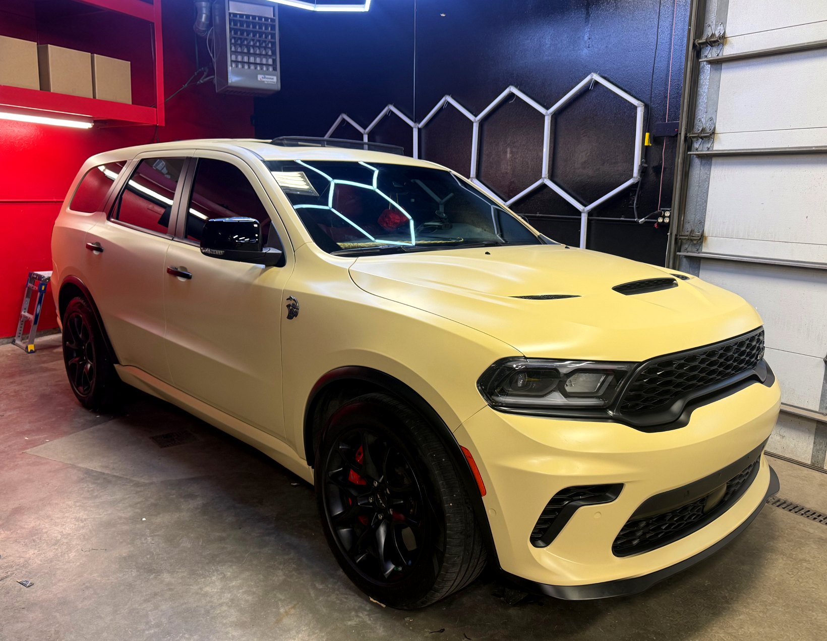 Matte cream wrapped Dodge Durango SRT Hellcat in the workshop