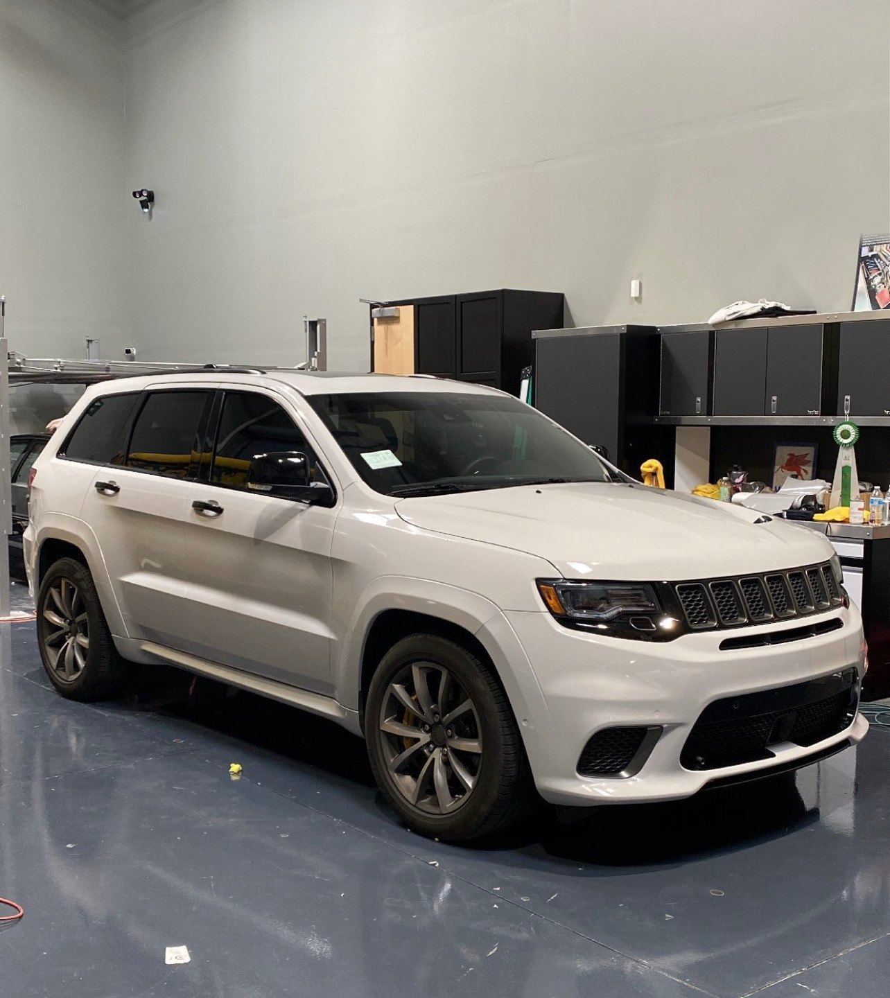 White wrapped Jeep Grand Cherokee in the workshop